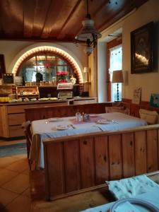 a dining room with a table in a restaurant at Landhaus Ingrid in Loich