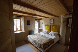 a bedroom with a large bed in a room at Le Magasin à Sel in Crozon