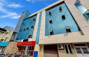 a building with bikes parked in front of it at RG SUITES Mount Road in Chennai