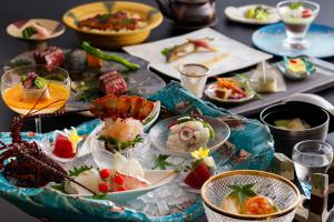 a table with many plates of food on it at Yumenoian Yuyake Koyake in Himeji