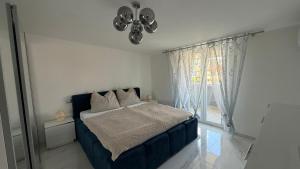 a bedroom with a bed and a ceiling fan at Laguna Blu in Montepaone Lido