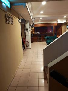 a room with a hallway with a living room at Shakim hotel in Cukai