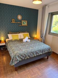 a bedroom with a large bed with yellow pillows at Apt "Laura" Terrasse - Parking - Plage - 5pers in Juan-les-Pins