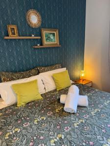 a bedroom with a large bed with yellow pillows at Apt "Laura" Terrasse - Parking - Plage - 5pers in Juan-les-Pins +24 photos