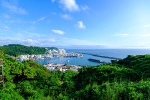 a view of a harbor with boats in the water at Hale Kai Akiya in Yokosuka