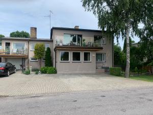a house with a car parked in front of it at Villa Mariett in Kuressaare