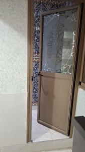 a door in a room with a window at Belle apt près de la mer in Tangier