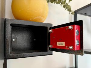 a red and black box next to a orange at BBB Parkside Studio city center in Budapest