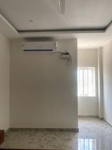 an empty room with a white wall and a ceiling at SANTHOSH RESIDENCy in Chengalpattu