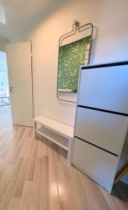 a room with a white dresser and a window at Kerese tn Apartment 1-2 persons in Narva