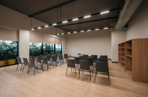 a large room with chairs and a table in it at The Canvas Loft-Manyata Tech Park-Orchid Parc in Bangalore