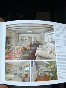 two photographs of a living room in a magazine at Arcadia Shepherds Hut in Ashwater