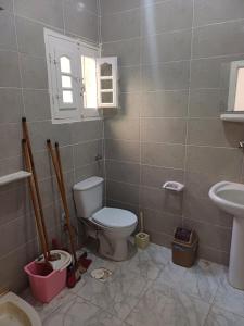 a bathroom with a toilet and a sink at HASH # SAAd in Marsa Matruh +42 photos