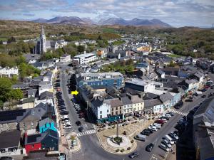 an aerial view of a small town with a street at Apartment 299 - Clifden in Clifden