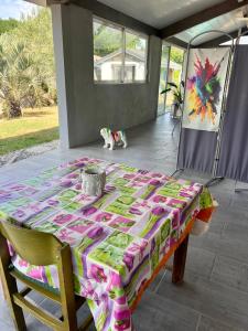 a table with a blanket on top of a patio at Chez Christelle in Audenge +21 photos