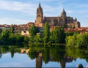 a view of a city from the river at Apartamento Turistico San Cristobal in Plasencia