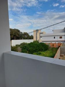a view from the balcony of a building at F3 entre nature et calme in Raʼs al Jabal