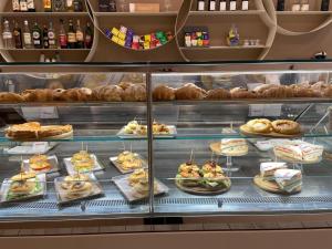 a display case in a bakery with various pastries at Al Tuscany in Lucca