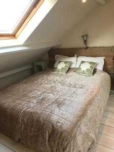 מיטה או מיטות בחדר ב-Het Huisje Breda