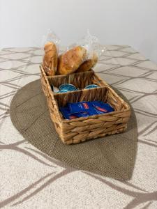 a basket of pastries sitting on a table at Casa Mediterraneo in Catania