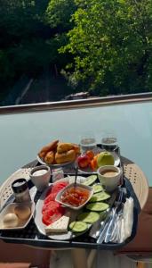 a tray of food on a table with food at Guest House Rean in Berat
