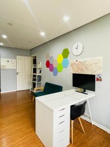an office with a desk and a computer on a wall at Gobi - Zen in Ulaanbaatar