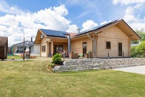 a house with solar panels on the roof at Ferienhaus Traum Teufel in Hettingen