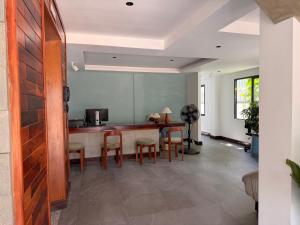 a living room with a table and chairs at Sonitori Riverside in Siem Reap