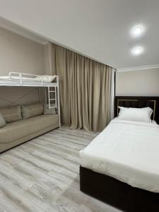 a bedroom with a bed and a bunk bed at Cottage in Bosteri