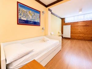 a bedroom with a large white bed in a room at Hostdomus - B3-03 in Grange Sises