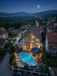 an aerial view of a house with a swimming pool at Apartments Nikolić in Soko Banja