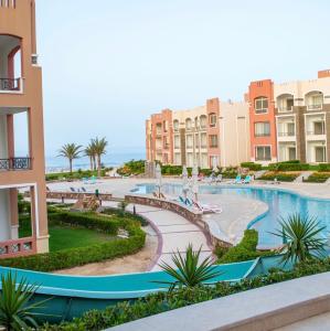 a view of a resort with a swimming pool at Oyster bey Beach Suites J1-04 in Marsa Alam