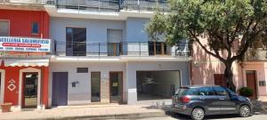 a car parked in front of a building at Domus Smeralda in Muravera