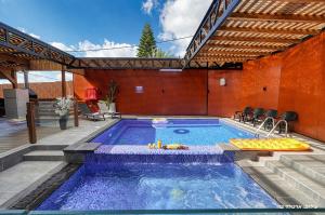 a swimming pool in a house with at Novus Luxury in Yarka
