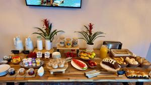 a table topped with lots of different types of food at Casa Regina Tenerife in Tamaimo