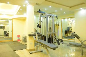 a gym with several tread machines in a room at Diamond Luxury Hotel plc in Desē +8 photos