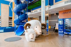 two stuffed animals are standing in a store at Kokotel Bangkok Dheva Thonglor in Bangkok