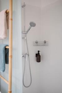 a shower with a shower head in a bathroom at Schmidsdorf 67 in Payerbach +49 photos