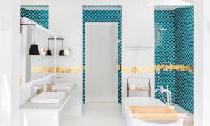 a bathroom with two sinks and a shower at Sun Siyam Iru Veli - 24 Hours Premium All Inclusive Dine Around with Free Sea Plane Transfers & Exclusive Inclusions in Dhaalu Atoll