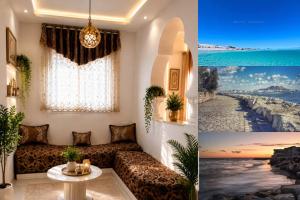 a living room with a couch and a table at Your Peaceful Retreat in Kelibia +2 photos