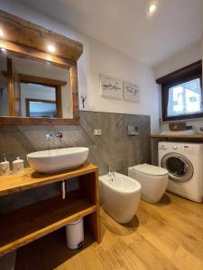 a bathroom with a sink and a toilet at Central Spacious Apartment, Mountain Views in Sauze d'Oulx +29 photos