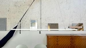 a staircase in a room with white walls at Grange habitée, nature & design in Manou