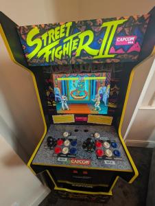 a game of street fighter ii in a box at Withnell Stays - Apartment Two - Retro Arcade Machine in Blackpool