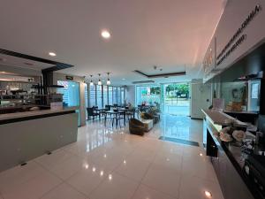 a large kitchen and living room with a dining room at Yenna Apt in Kamala Beach