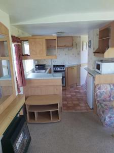 a small kitchen in a small home with a caravan at Sky house in Jūrmala