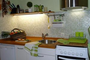 a kitchen with a sink and a counter top at Altes Kontor in Bad Sulza +3 photos