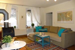 a living room with a couch and a table at Altes Kontor in Bad Sulza