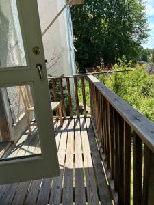 an open door to a porch with a deck at Storgatan 42 in Högsby