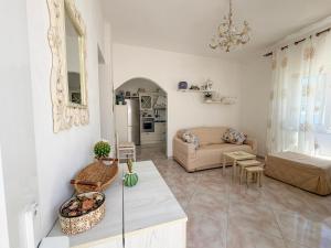 a living room with a couch and a table at La Casa di Barbara in Ponza