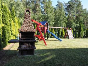 a park with a playground with a play equipment at Apartamenty bez barier in Rydzewo